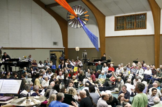 Audience members assemble for the performance